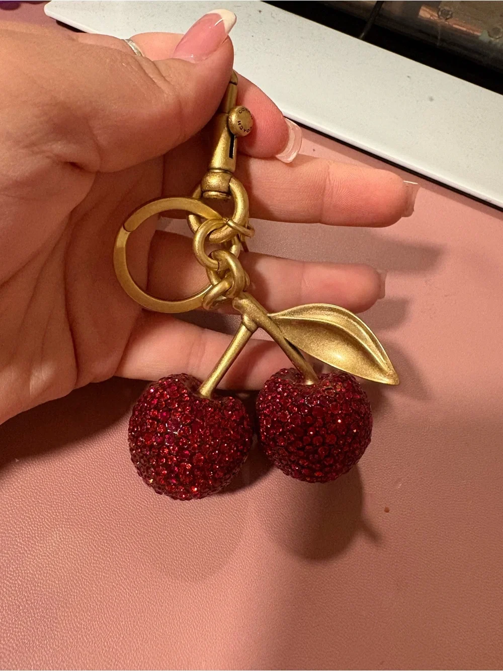 Coach Gold-Tone Cherry Charm Keychain with Red Crystals